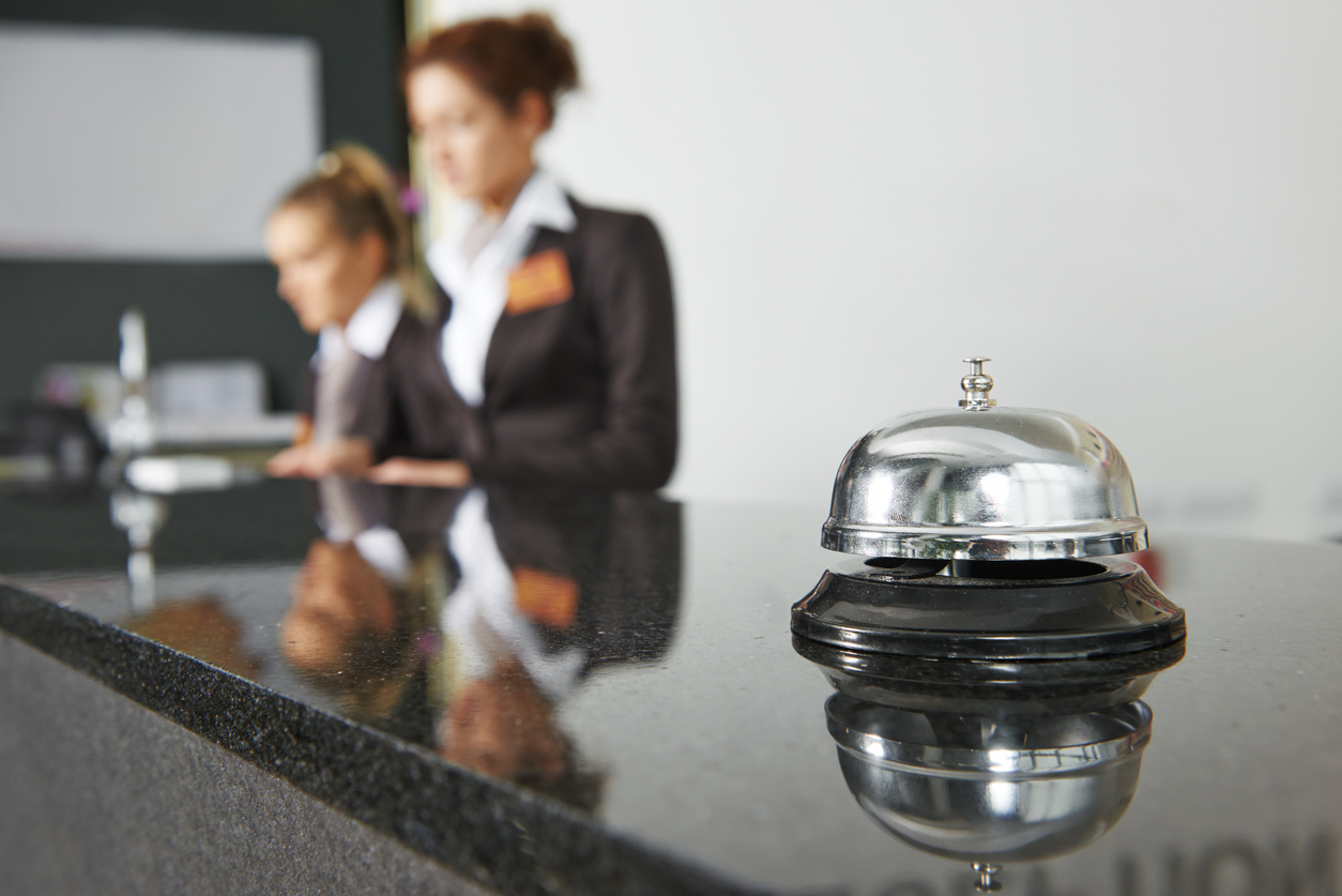 hotel receptionist counter with bell