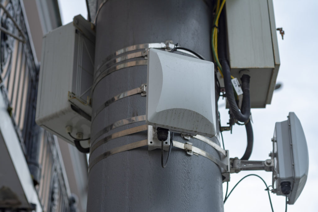 Microcell repeaters installed on pole in outdoor environment, microcells in use