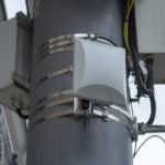 Microcell repeaters installed on pole in outdoor environment, microcells in use
